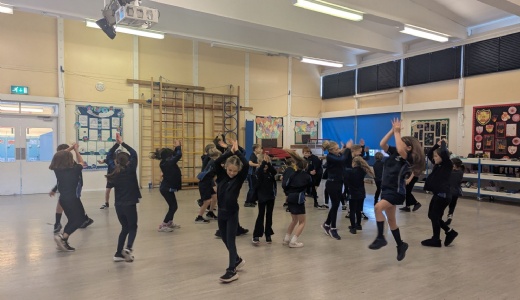 Picture showing Y4 children participating in  their Diwali dance.