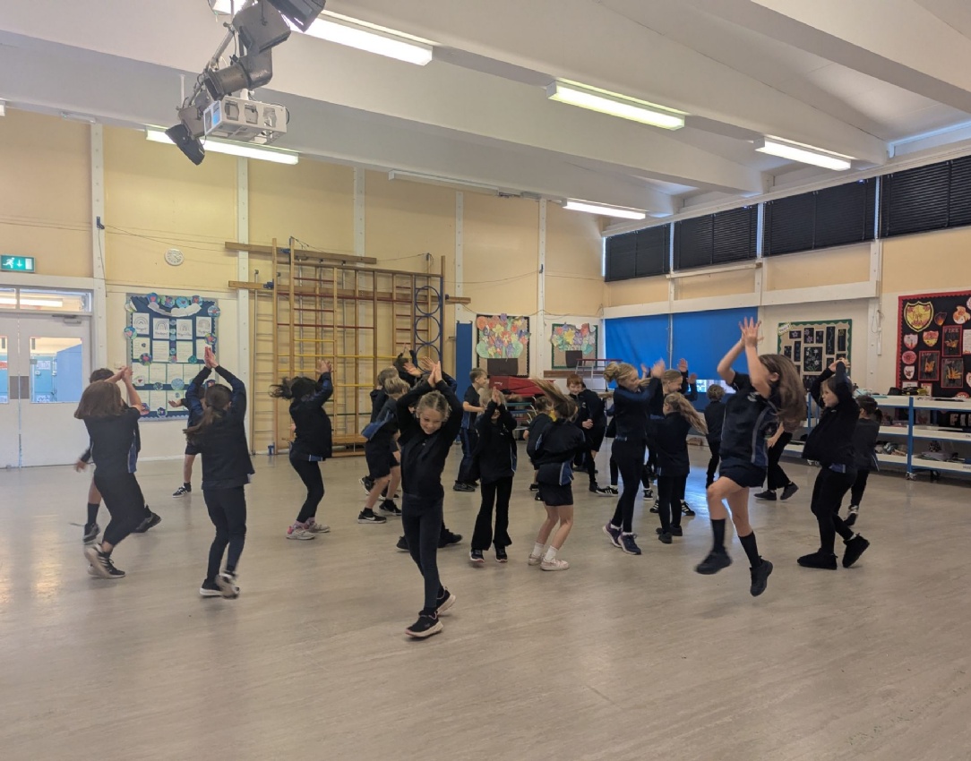 Picture showing Y4 children participating in  their Diwali dance.
