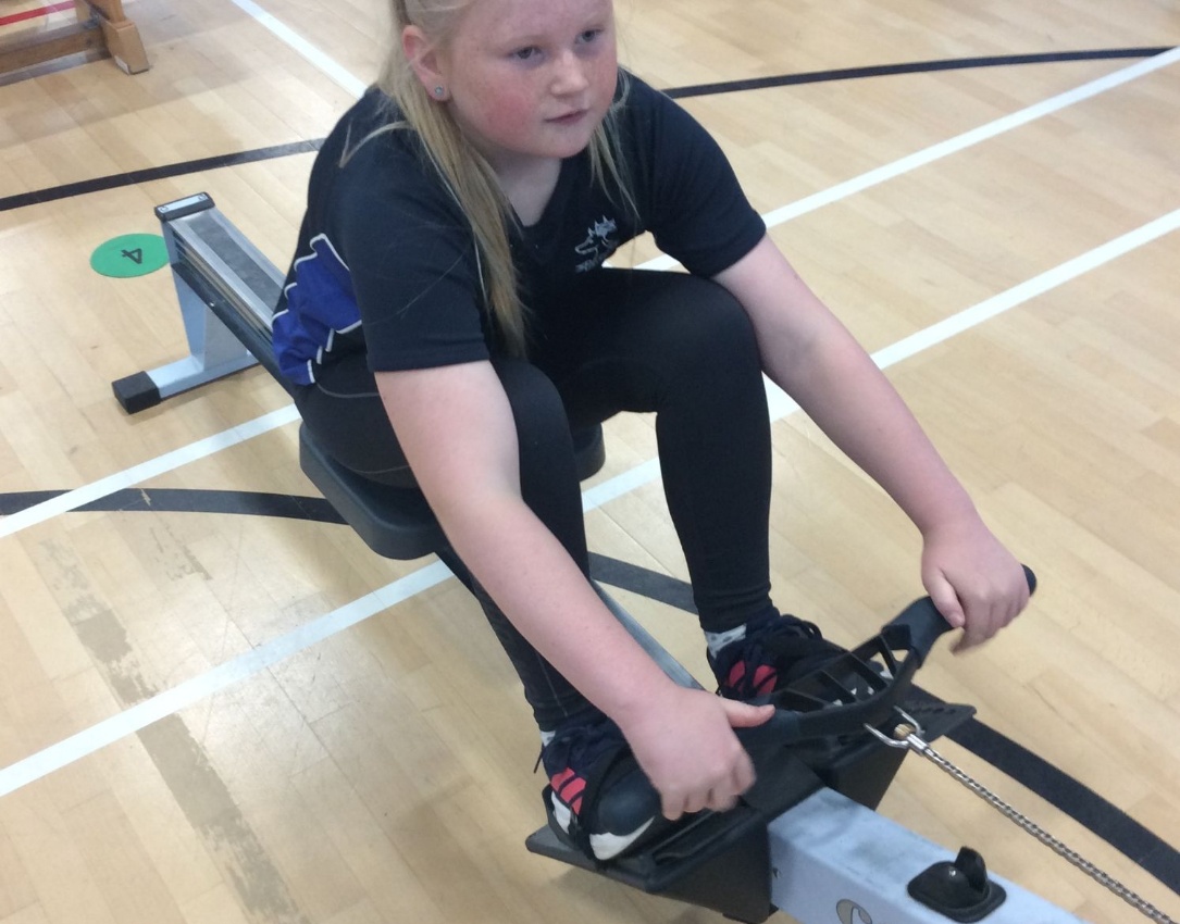 Y6 pupil pictured rowing at the indoor rowing competition.